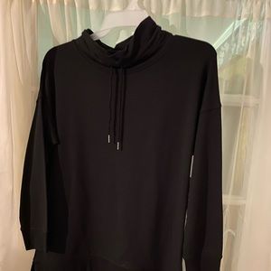 Boys black shirt with pull string around the neck for outstanding style.